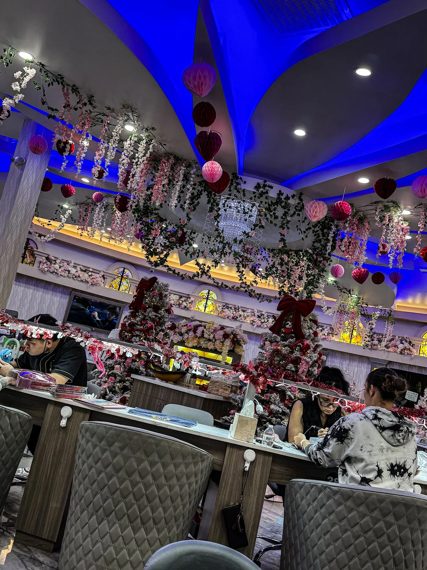 Manicure bar decorated with hanging floral garlands