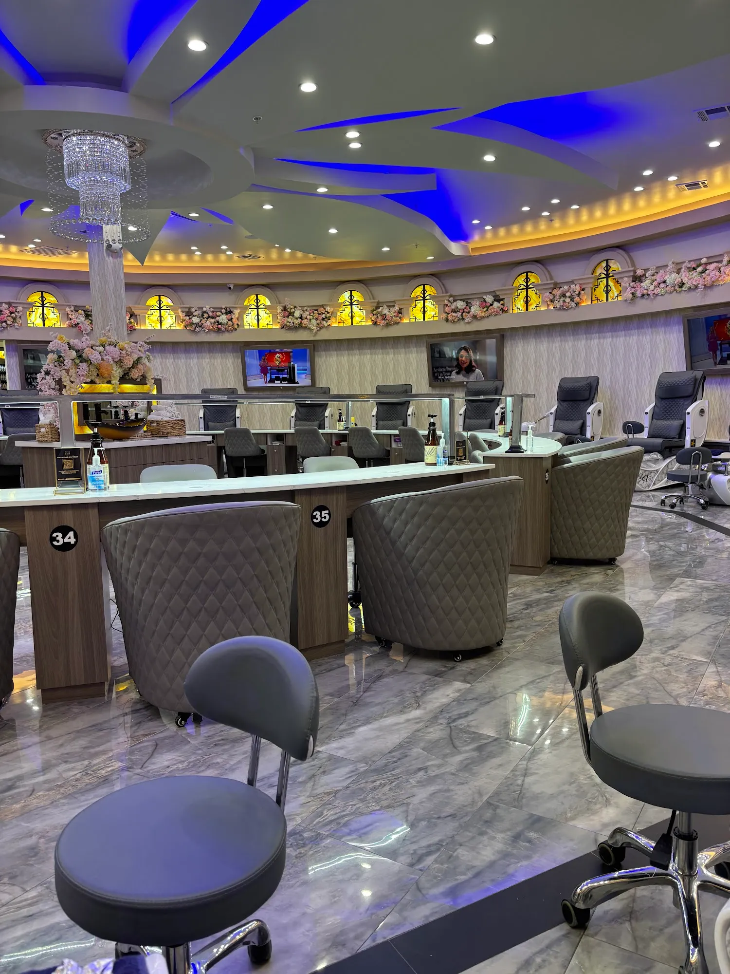 Manicure stations in front of the pedicure lounge