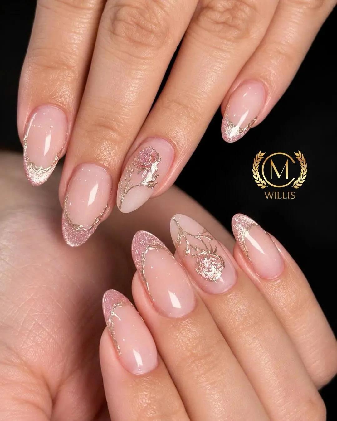 Soft nude almond nails with silver glitter and sparkle accents