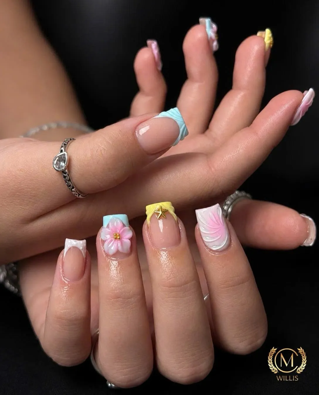 Pastel French tip square nails with flower accents